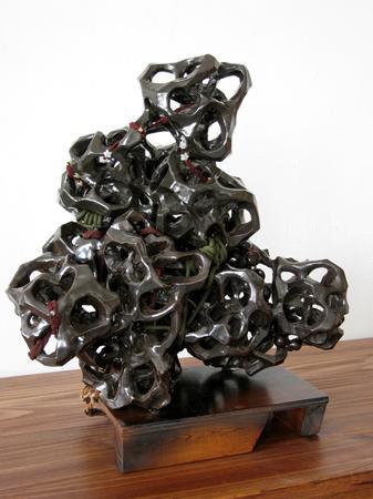   Dark Cloud, 2006, glazed ceramic modules, rope, beads, and nuts, H: 28 in; photo courtesy the artist  